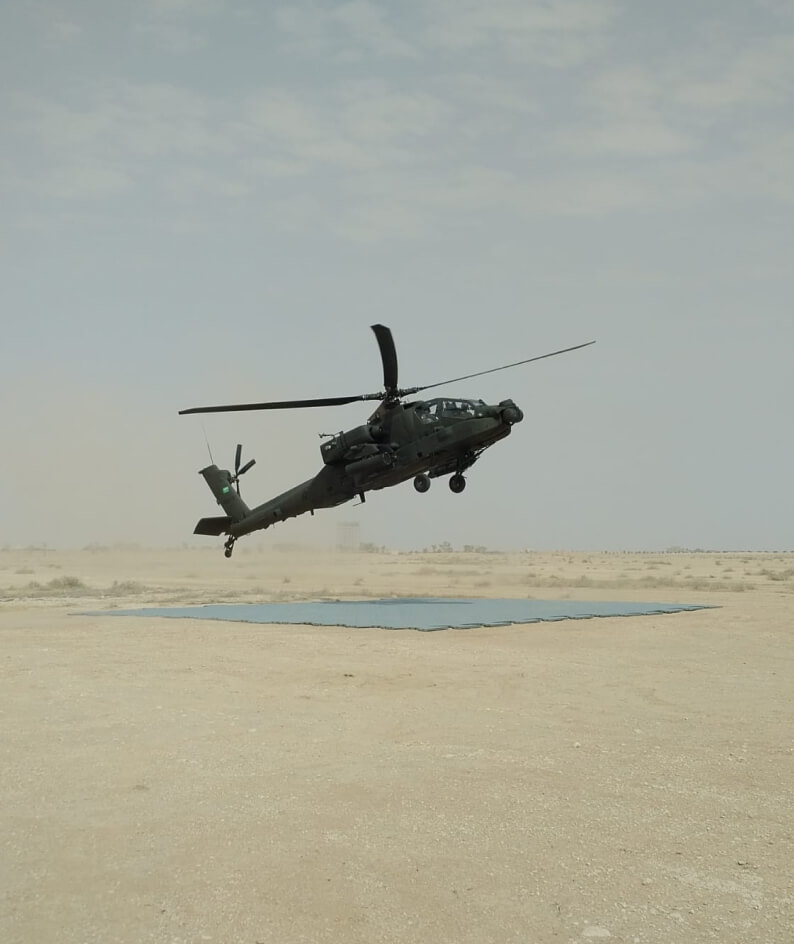 an image of a helicopter taking off in the desert
