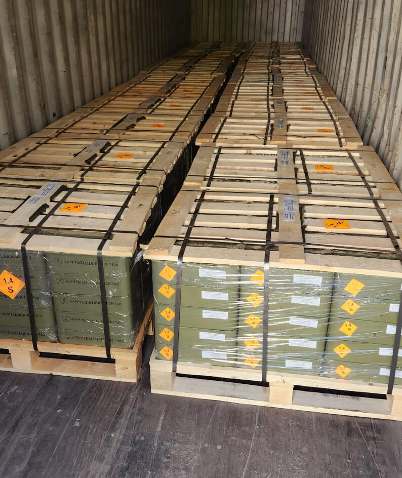 a shipping container full of crates of military gear