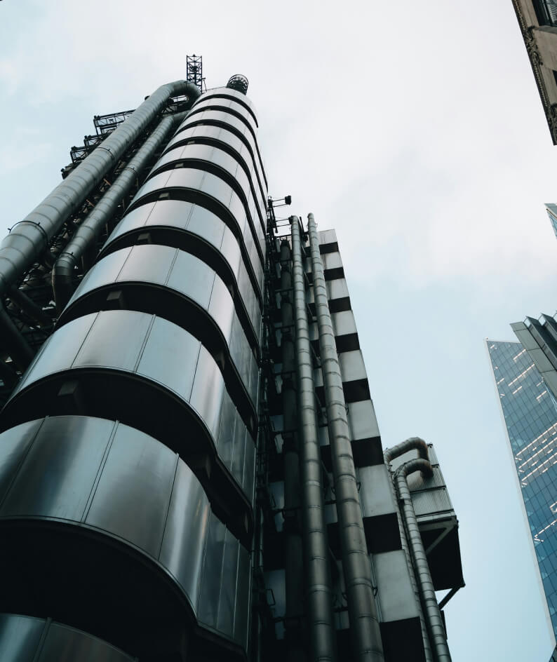 an image looking up the the sky at a sky scraper building